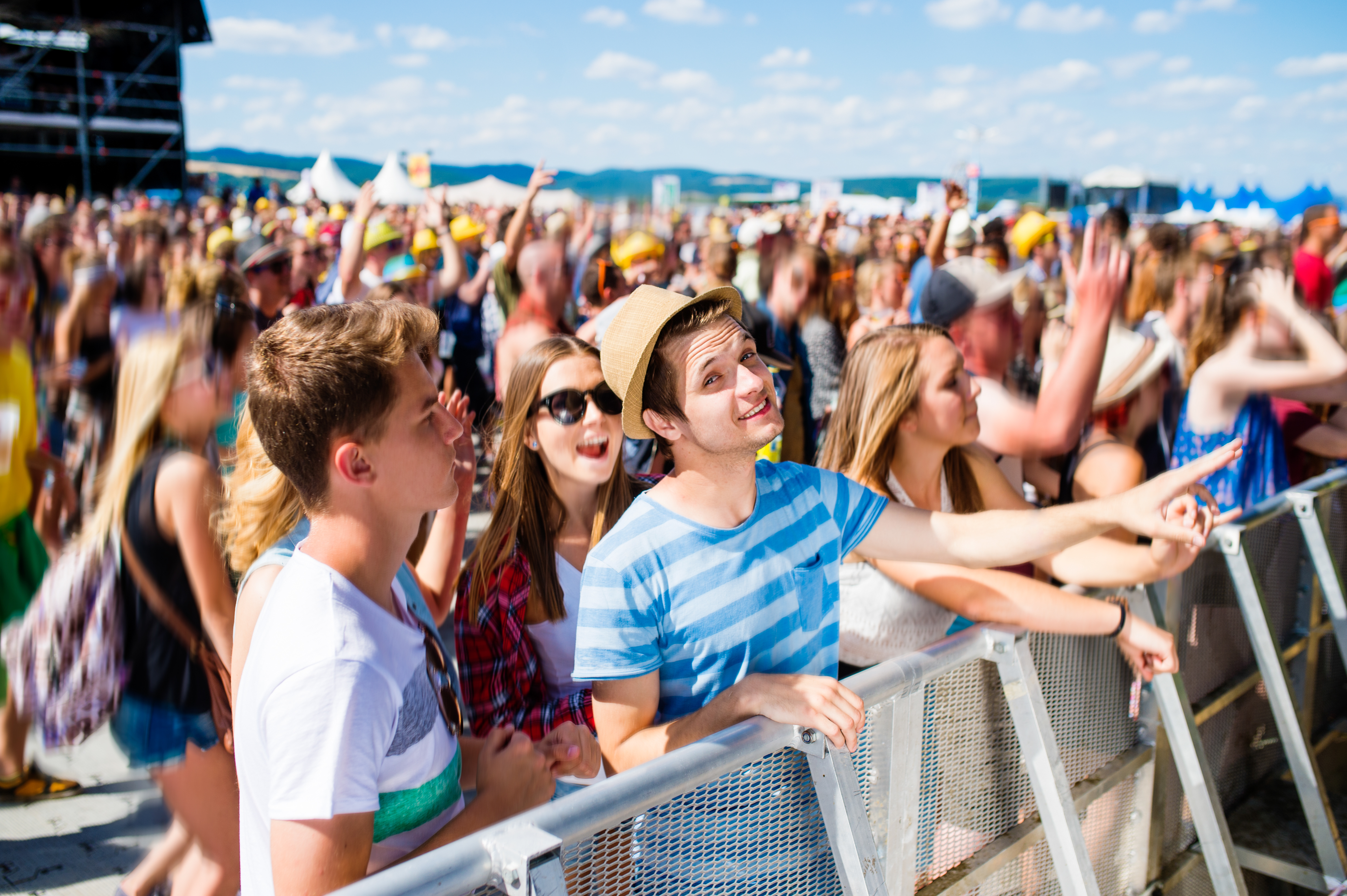 graphicstock teenagers at summer music festival under the stage in a crowd enjoying themselves BugGqsmBzb